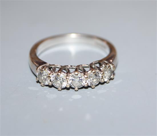 An 18ct white gold and five stone diamond half hoop ring, size N.